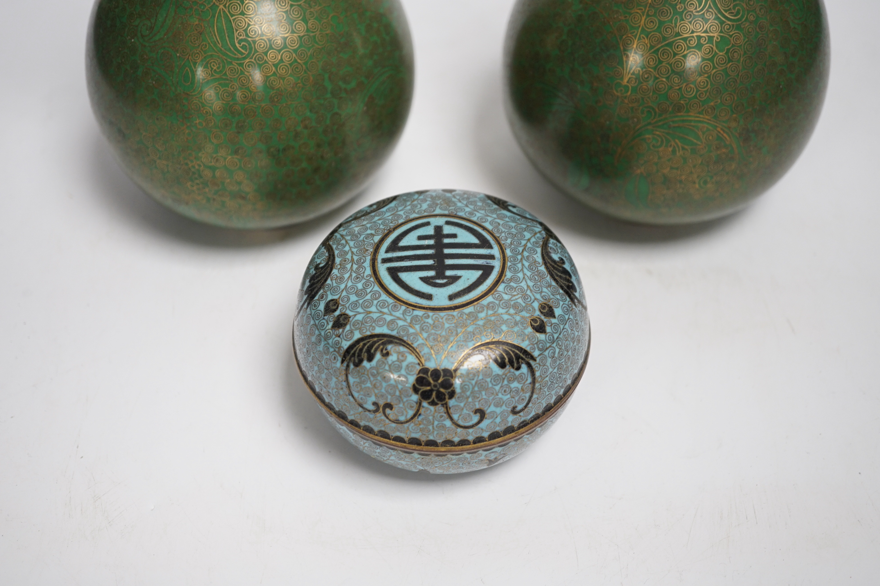 A pair of Chinese cloisonne enamel vases and a box and cover, tallest 23cm